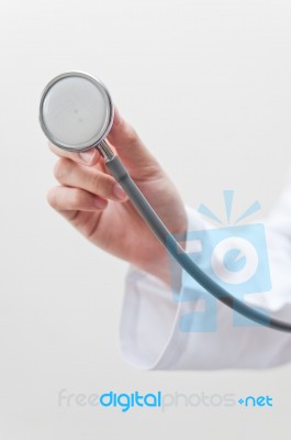 Doctor Holding Stethoscope Stock Photo