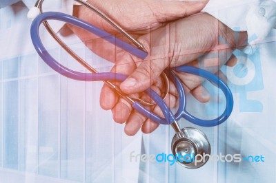 Doctor Holds The Device For A Fever Stock Photo