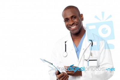 Doctor In A Uniform Holding A Clipboard Stock Photo