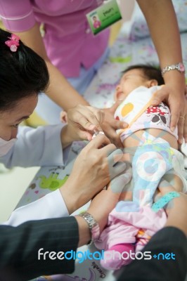 Doctor Injects A Baby Stock Photo