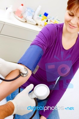 Doctor Measuring Blood Pressure Stock Photo