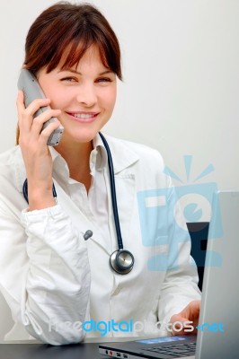 Doctor On Phone Stock Photo