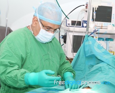 Doctor Starting A Surgery Stock Photo