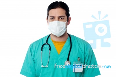 Doctor With Stethoscope And Face Mask Stock Photo