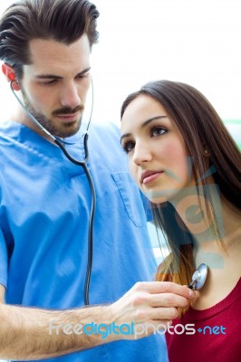 Doctor With Stethoscope Checking A Patient Stock Photo