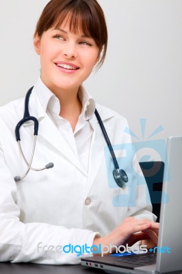 Doctor Working On Laptop Stock Photo