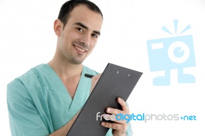 Doctor Writing On Notepad Stock Photo