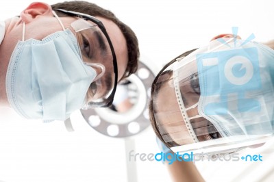 Doctors Focusing On Specific Area Stock Photo