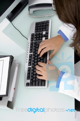 Doctor's Hand On Keyboard Stock Photo