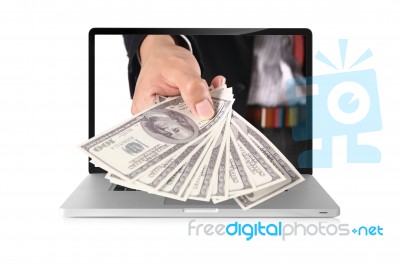 Dollars On Laptop Stock Photo