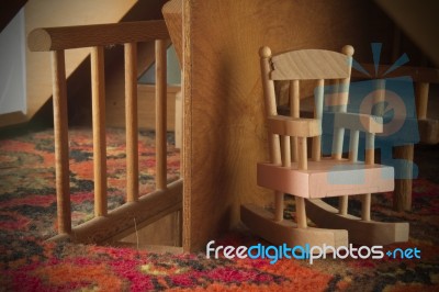 Dollhouse Rocking Chair And Staircase Stock Photo