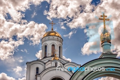 Dome Of A Temple Against A Blue Cloudy Sky Stock Photo