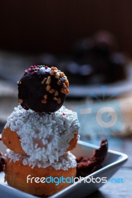 Donuts And Chocolate On The Plate Stock Photo