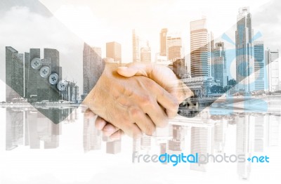 Double Exposure Handshake Of Business Peoples Stock Photo