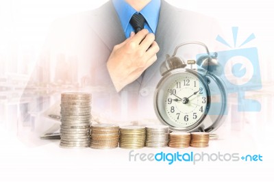 Double Exposure Of Businessman With A Row Of Stack Money Coins Stock Photo