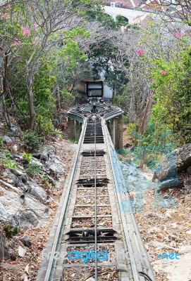 Down The Hill Railway, Train Track, With Forest And Blue Sky Stock Photo