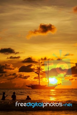 Dramatic Sea And Transport Boat In Color Of Sunset Stock Photo