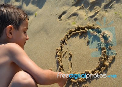 Drawing In The Sand Stock Photo