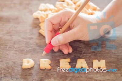 Dream Alphabet Biscuit On Wooden Table Stock Photo