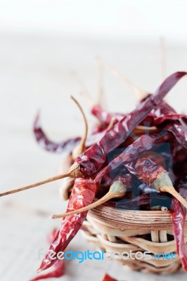 Dried Chilly On Wooden Stock Photo