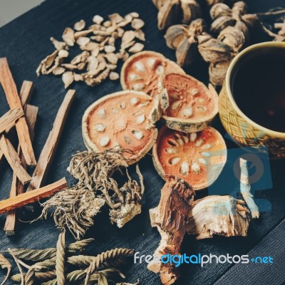 Dried Herbs And Ginseng, Top View Of Thai Herbs And Ginseng On Wooden Floor Stock Photo