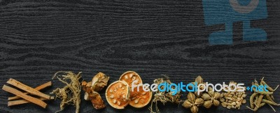 Dried Herbs And Ginseng, Top View Of Thai Herbs And Ginseng On Wooden Floor Stock Photo