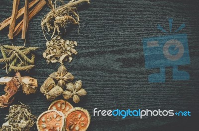 Dried Herbs And Ginseng, Top View Of Thai Herbs And Ginseng On Wooden Floor Stock Photo