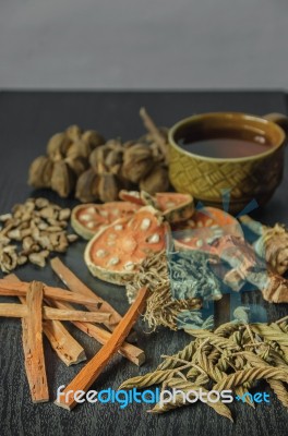 Dried Herbs And Ginseng, Top View Of Thai Herbs And Ginseng On Wooden Floor Stock Photo