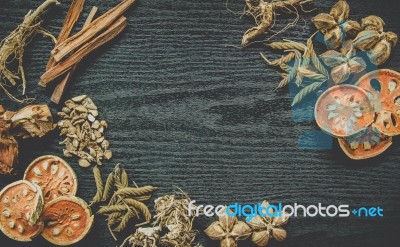 Dried Herbs And Ginseng, Top View Of Thai Herbs And Ginseng On Wooden Floor Stock Photo