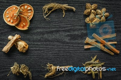 Dried Herbs And Ginseng, Top View Of Thai Herbs And Ginseng On Wooden Floor Stock Photo