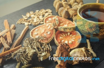 Dried Herbs And Ginseng, Top View Of Thai Herbs And Ginseng On Wooden Floor Stock Photo