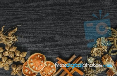 Dried Herbs And Ginseng, Top View Of Thai Herbs And Ginseng On Wooden Floor Stock Photo