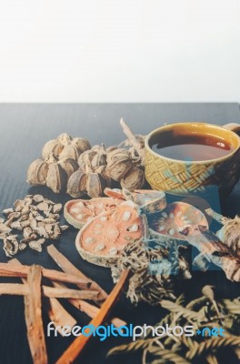 Dried Herbs And Ginseng, Top View Of Thai Herbs And Ginseng On Wooden Floor Stock Photo