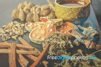 Dried Herbs And Ginseng, Top View Of Thai Herbs And Ginseng On Wooden Floor Stock Photo