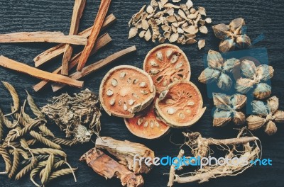 Dried Herbs And Ginseng, Top View Of Thai Herbs And Ginseng On Wooden Floor Stock Photo