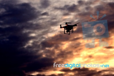 Drone Flying During Sunset Stock Photo