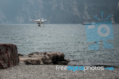 Drone Hovering On The Shoreline At Riva Del Garda Stock Photo