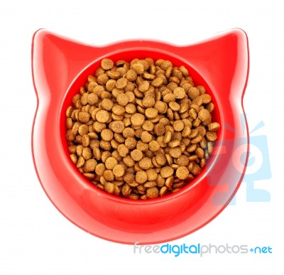 Dry Brown Pet Food For Cat In The Red Plastic Bowl Stock Photo