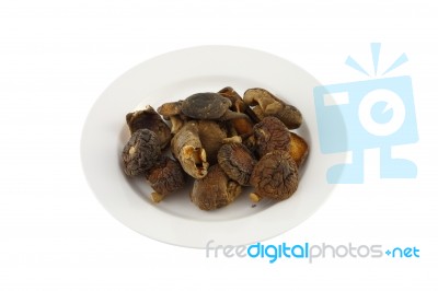 Dry Chinese Mushroom Dish On White Background Stock Photo