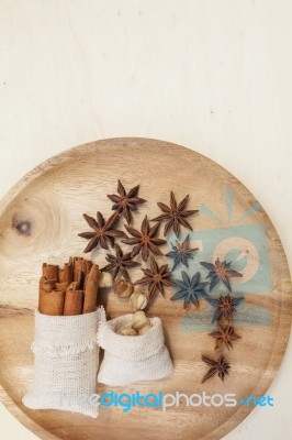 Dry Herbs In Canvas Bag On Round Wooden Tray Stock Photo