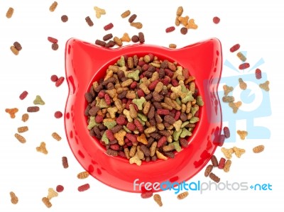 Dry  Multicolored  Pet Food For Cat In The Red Plastic Bowl Stock Photo