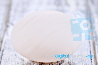 Duck Egg On White Painted Table Surface Stock Photo