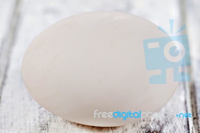 Duck Egg On White Painted Table Surface Stock Photo