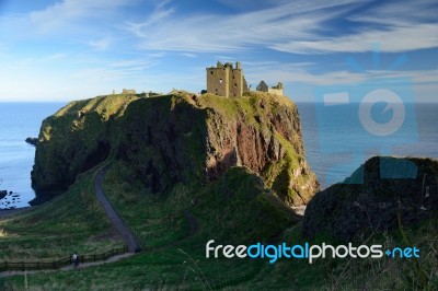 Dunnottar Castle With Blue Sky Background Stock Photo