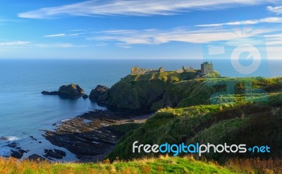 Dunnottar Castle With Blue Sky Background In Aberdeen, Scotland Stock Photo