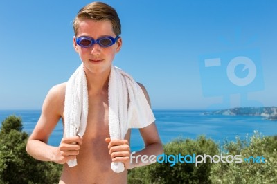 Dutch Boy Holding Towel  And Wearing Swimming Goggles In Front O… Stock Photo