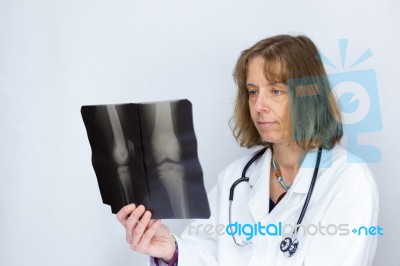 Dutch Female Doctor Looking At X-ray Photo Stock Photo