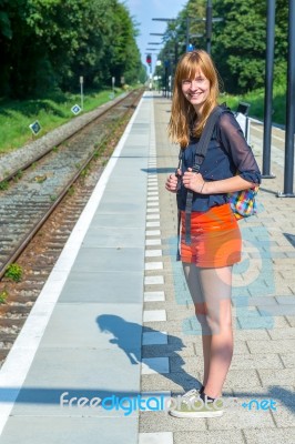 Dutch Teenage Girl Standing At Station Waiting On Train Stock Photo