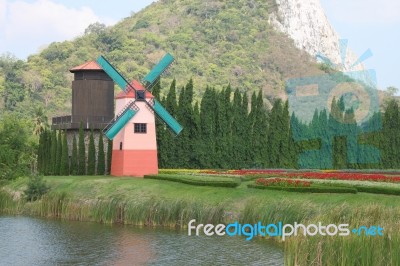 Dutch Windmill Front Of Country Farm Stock Photo