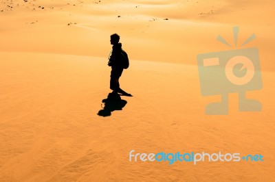 Early Morning Climbers On Sand Dune Near Sossusvlei, Namibia Stock Photo